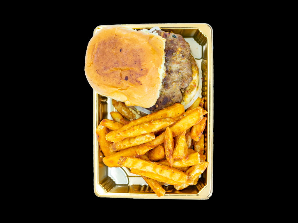 Addah's beef chapli kebab slider with seasoned fries on a gold tray