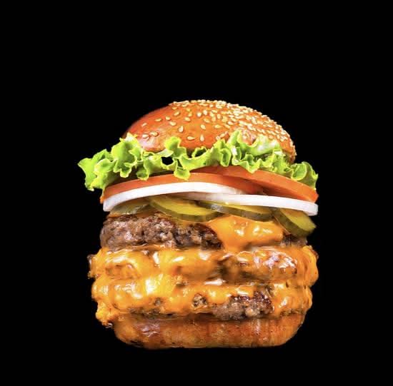 Burger Factory Compressor triple cheeseburger with lettuce, tomato, onion and pickles on a sesame bun
