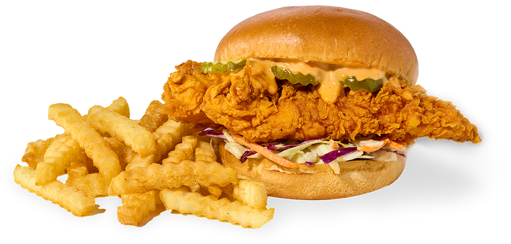 Byrd's chicken sandwich with slaw, pickles and sauce beside crinkle-cut fries