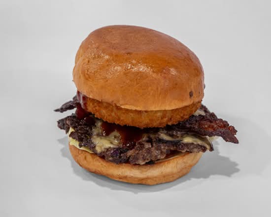 The Halal Burger's Cowboy with an onion ring, turkey bacon, cheese and beef on a brioche bun