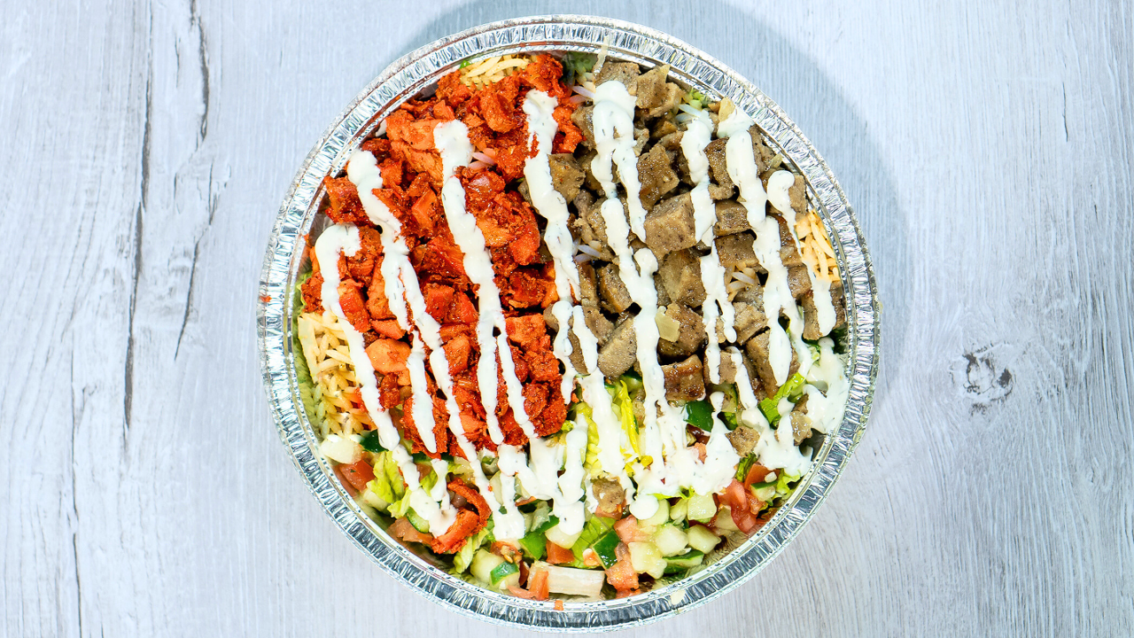 Naz's combo platter with chicken, gyro meat, rice, salad and white sauce